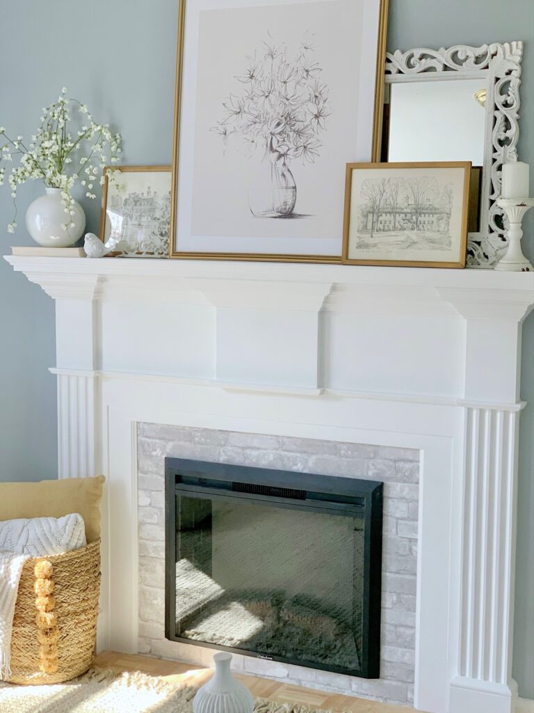 Our fireplace in our guest bedroom completed with gray brick wallpaper around the insert. 
