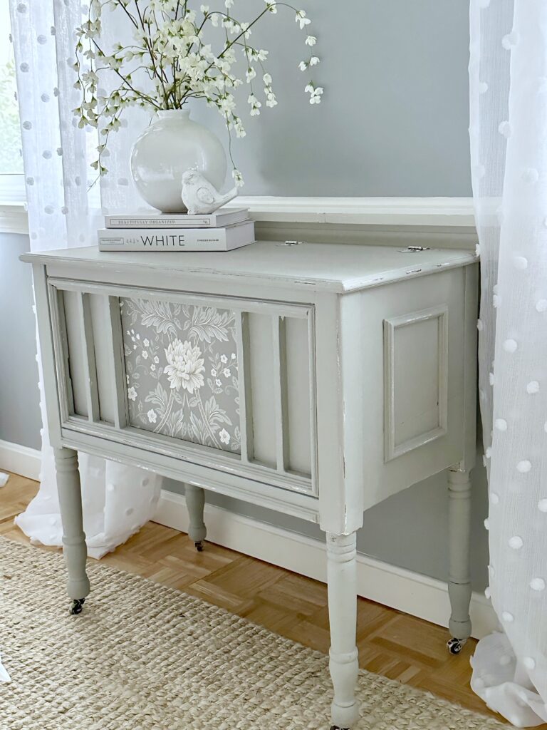 A grey painted piece of furniture