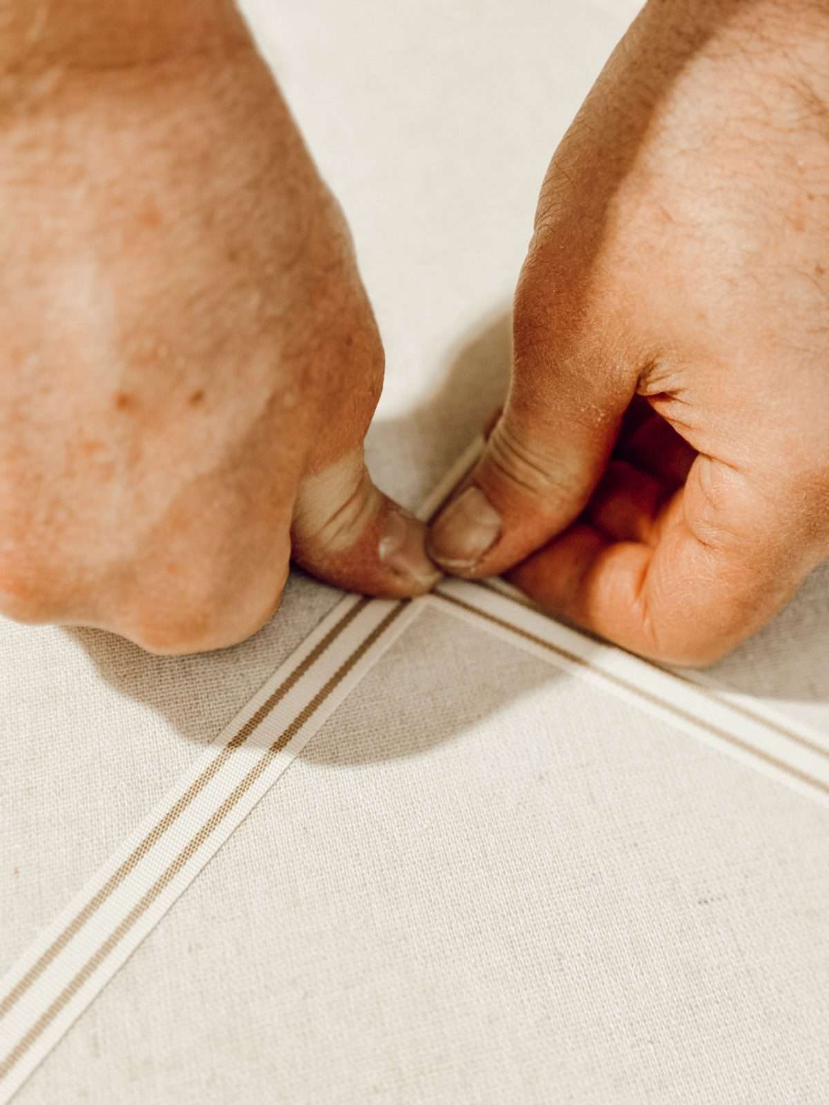 Push the upholstery nail into the pin board to finish the DIY project.