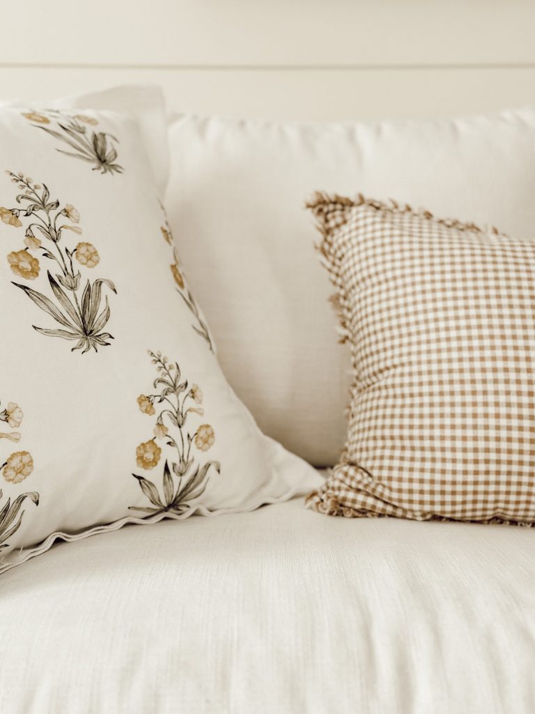 Block print & gingham decorative pillows are a great way to add visual interest to a couch.