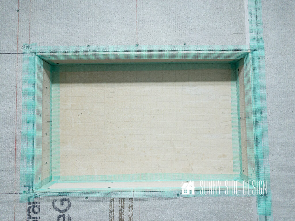 Mold and mildew resistant mesh is applied to all of the niche seams.